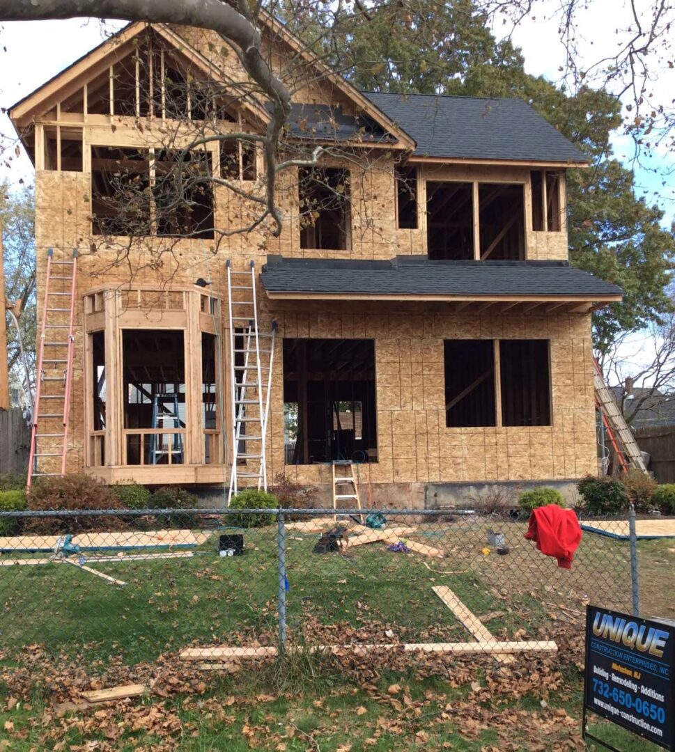 A house being built with scaffolding around it.